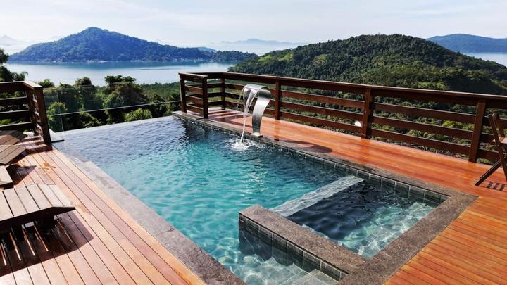 The infinity pool spilling toward Paraty Bay