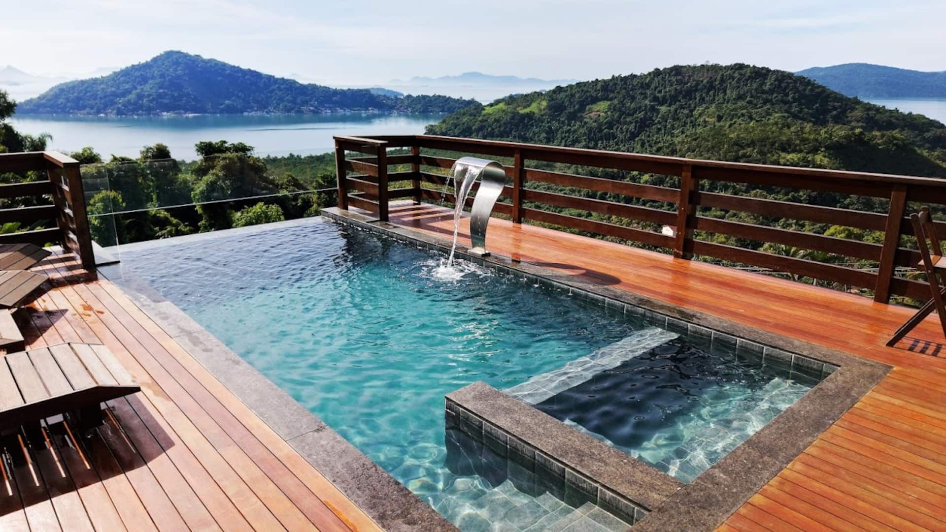 The infinity pool spilling toward Paraty Bay