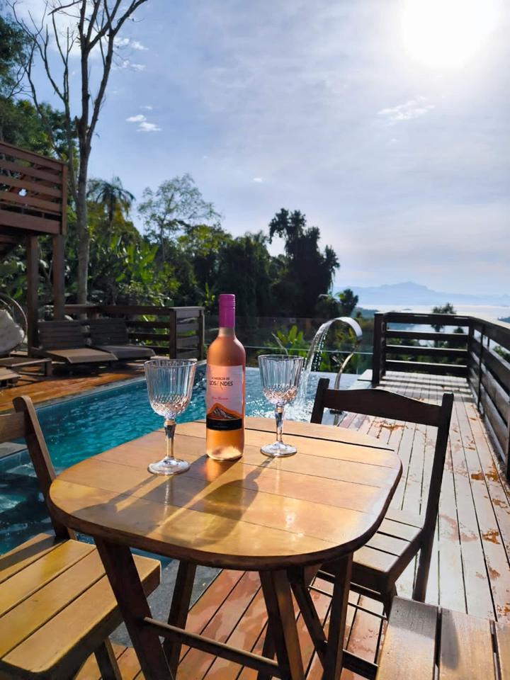A glass of wine at the water's edge