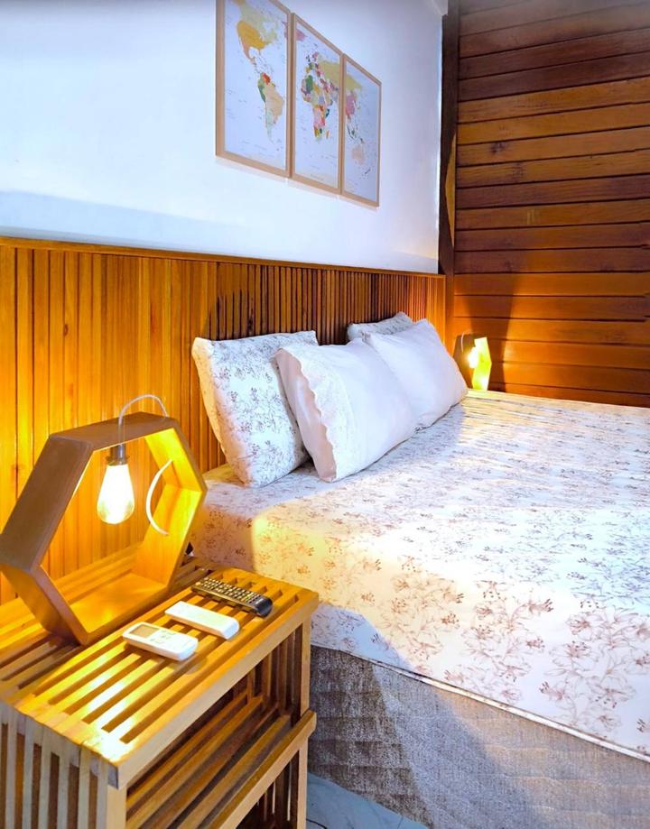A queen room in warm timber